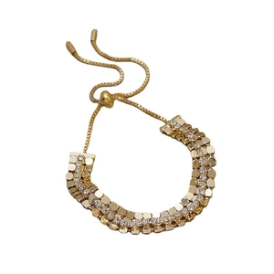 Bracciale dorato geometrico vintage con cristalli scintillanti e chiusura regolabile