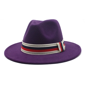 Detail of the purple wool fedora hat featuring a stylish tricolor striped ribbon band