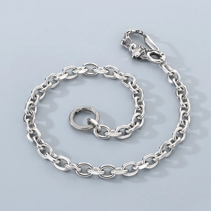Detailed view of silver punk style metal pants chain featuring animal head spring clasp
