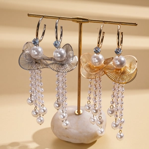 Elegant C-shaped tassel earrings with blue zircon, large pearls and leaf design in gold and silver