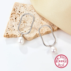 Elegant 925 sterling silver drop earrings featuring natural white teardrop pearls for women