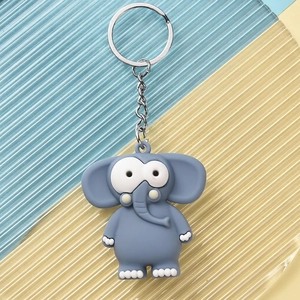 Close-up of grey elephant keychain with big eyes and soft rubber texture details