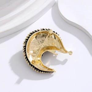 Exquisite gold hedgehog brooch with textured metal back and secure safety pin closure