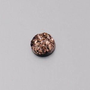 Detail of 6mm round resin crystal with sparkling gold mineral druzy texture for DIY jewelry