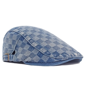 Retro blue and white checkered denim ivy cap with metal buckle on white background