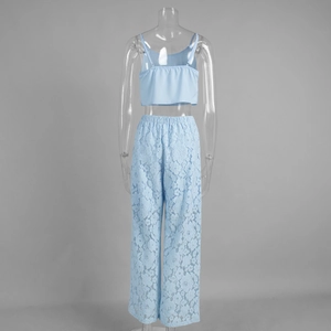 Detail of light blue lace wide-leg trousers and cropped camisole set from back view
