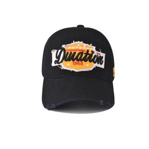Close-up of black cotton baseball cap with embroidered patch and distressed brim details