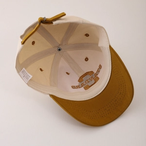 Beige and ochre cotton baseball cap with adjustable strap and internal mesh support
