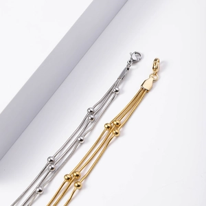 Three-layer stainless steel snake chain bracelet with gold beads and lobster clasp
