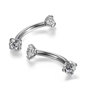 Silver curved barbell body piercing jewelry with clear cubic zirconia stones in a pair