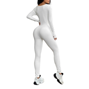 Back view of white ribbed yoga jumpsuit for women with long sleeves and high elasticity