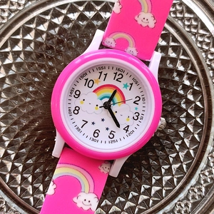 Pink quartz kids watch featuring a cute rainbow print and a soft silicone strap for girls