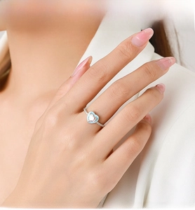 Close-up of S925 sterling silver ring featuring a colorful heart zircon and pavé stones