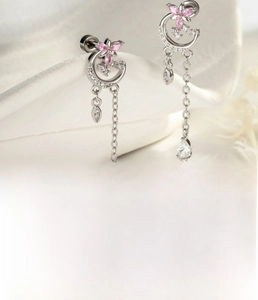 Detail of silver moon stud with pink flower, chain tassel and water-drop zircon stone