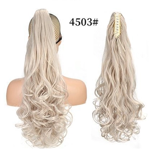 Claw clip ponytail detail showing the inner clip structure and wavy light blonde hair