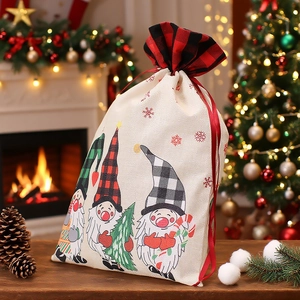Christmas gnome drawstring gift bag with plaid hats on wooden table by a fireplace