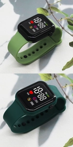 Close-up of square LED digital watches in mint and dark green showing health tracking UI