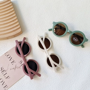 Retro round matte kids sunglasses in green and cream colors with UV400 protection
