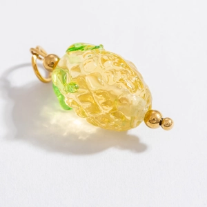 Macro shot of pineapple fruit glass pendant with 18k gold-plated stainless steel clasp