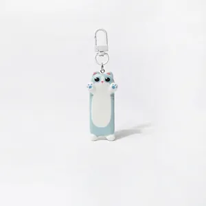Detailed view of a light blue and white cute cat keychain charm with a glossy finish