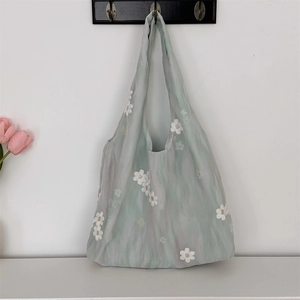 Detail of 3D white floral embroidery on light green aesthetic canvas tote bag