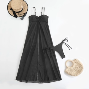 Flat lay of black mesh beach cover-up with metal ring detail and tie-side bikini bottoms