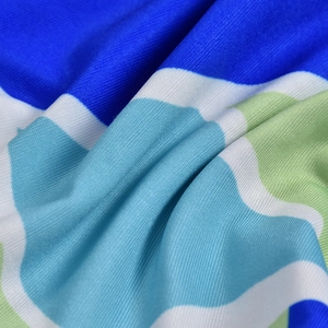 Detailed close-up showing breathable blue wave pattern knit fabric and texture