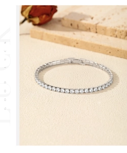 Close-up of sparkling S925 sterling silver tennis bracelet with cubic zirconia and red rose