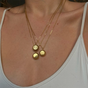 Three-layer gold zodiac medallion necklace for women featuring embossed celestial pendants
