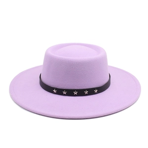 Detail of light purple wool fedora hat featuring black band with silver star metal studs