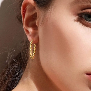 Classic golden twisted rope hoop earrings for women with high-shine metallic finish