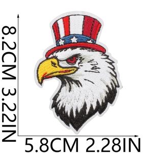 Detailed embroidery of American bald eagle patch with Uncle Sam hat on white background