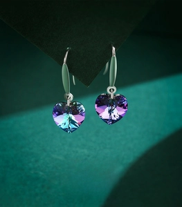 Detail of S925 sterling silver heart earrings with colorful gradient crystal stones