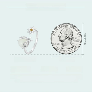 Detail of adjustable S925 sterling silver bee ring showing dimensions next to a coin
