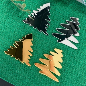 Set mit 4 weihnachtlichen Cupcake-Toppern aus Acryl in Gold und Silber auf Stoff