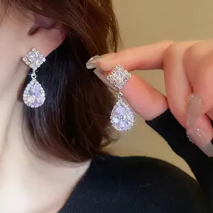 Elegant zircon rhombus and pear-shaped drop earrings set with silver-tone finish