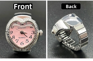 Detail view of heart-shaped ring watch with pink dial and elastic silver band