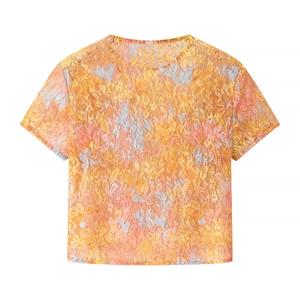 Back view detail of orange floral lace mesh crop top showing sheer texture and patterns