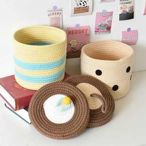 Handwoven cotton rope storage baskets with lids in various colorful striped patterns