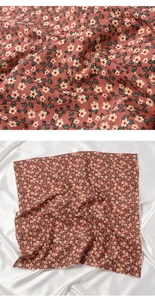 Close-up of soft floral pattern square scarf in dark pink with delicate white flowers