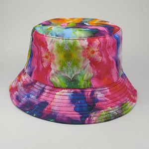Close-up of vibrant tie-dye pattern on breathable fabric of a reversible bucket hat