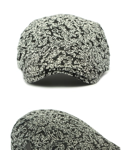 Detailed view of vintage black and white floral jacquard texture on a retro ivy cap