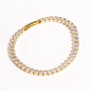 Close-up of elegant gold bracelet featuring sparkling drop-cut zircon stones on white background