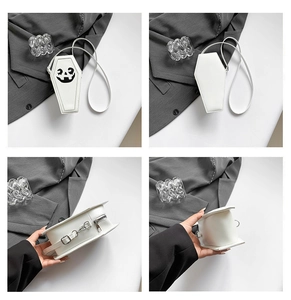 Detailed views of a white coffin-shaped crossbody bag with Halloween pumpkin face design