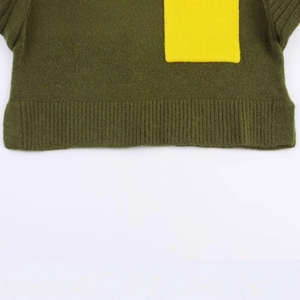 Deep olive green knit sweater with a contrasting bright yellow pocket and ribbed hem