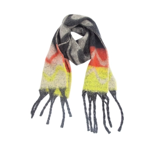Close-up of thick mohair-like scarf featuring colorful wave patterns and fringe detail