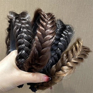 Close-up of four colors of braided fishtail headband in synthetic hair fiber