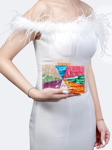 Detail of colorful acrylic clutch bag with marble texture pattern held by a model