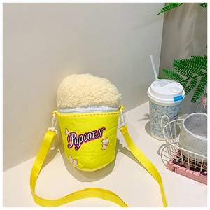 Creative popcorn bucket style crossbody bag with yellow body and plush white top design