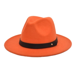 Detail view of orange wool fedora hat with black leather band and golden buckle